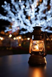 Close-up of illuminated light on table