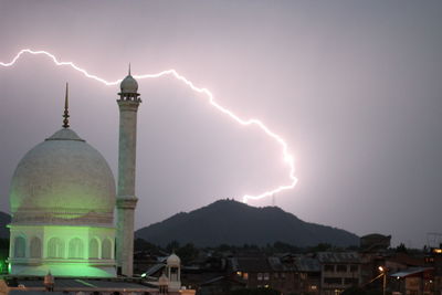 View of illuminated building against sky at night