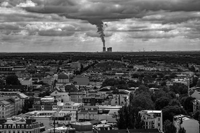 High angle view of cityscape against cloudy sky