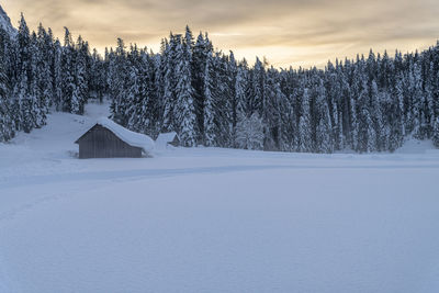 Scenic view of snow covered landscape against sky