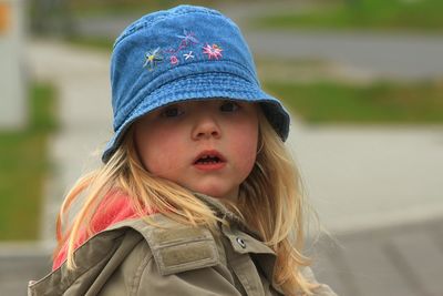 Portrait of cute girl wearing denim hat