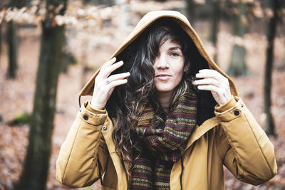 Portrait of young woman standing outdoors