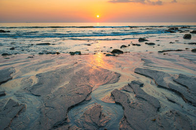 Scenic view of sea against sky during sunset