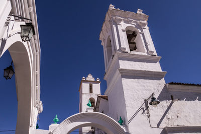 Low angle view of building against clear blue sky