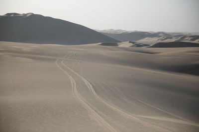 Scenic view of desert against clear sky