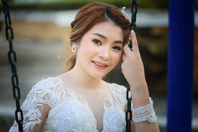 Portrait of young woman at park