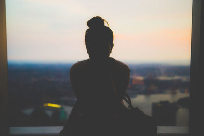 Silhouette of woman at sunset