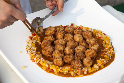 Cropped image of chef preparing food