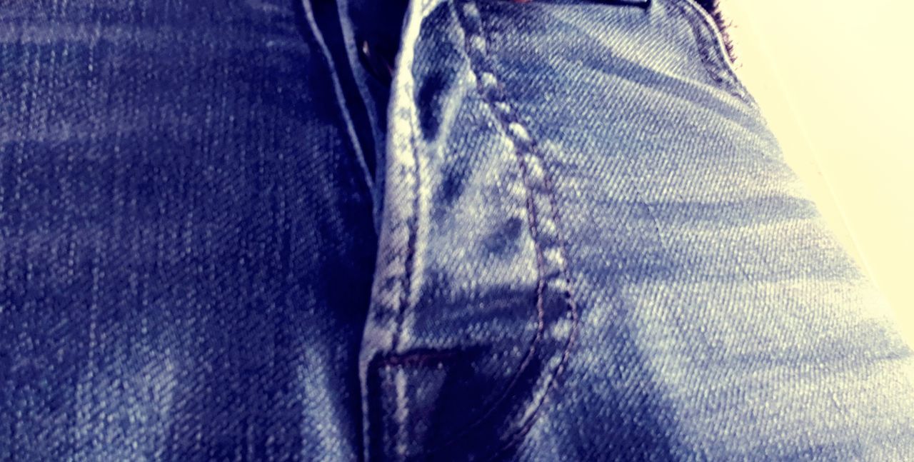 blue, jeans, denim, textile, casual clothing, clothing, human leg, close-up, one person, indoors, fashion, lifestyles, midsection