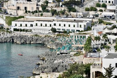 High angle view of townscape by sea