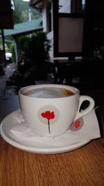 Close-up of coffee cup on table