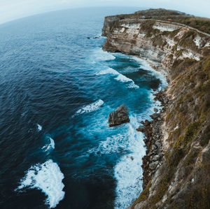 High angle view of rocks on sea