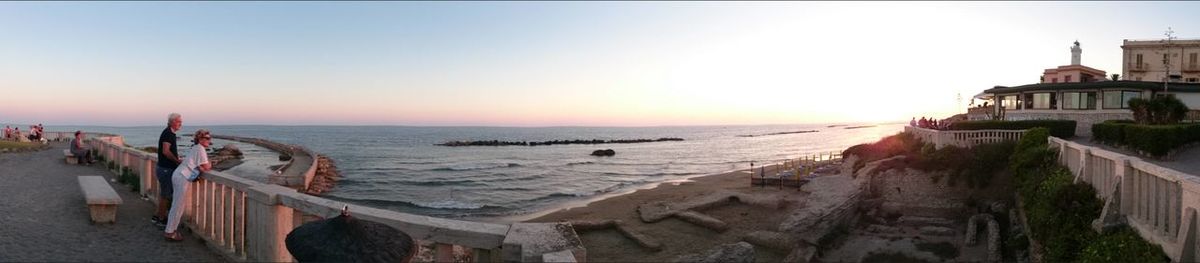 Panoramic view of sea and buildings against clear sky