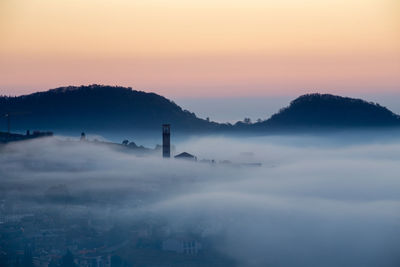 Scenic view of silhouette mountain against sky during sunset