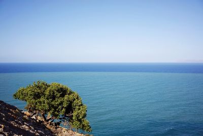 Scenic view of sea against clear blue sky