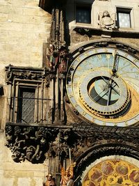 Low angle view of clock on building