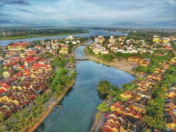 High angle view of river amidst buildings in city