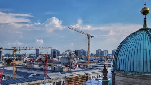 Commercial dock against cloudy sky