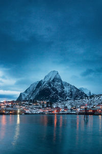 Scenic view of sea and mountains against sky in reine norway