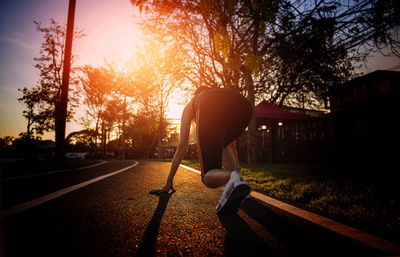 Rear view of woman walking on street