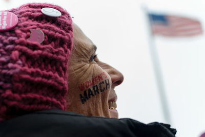 Close-up portrait of woman wearing hat