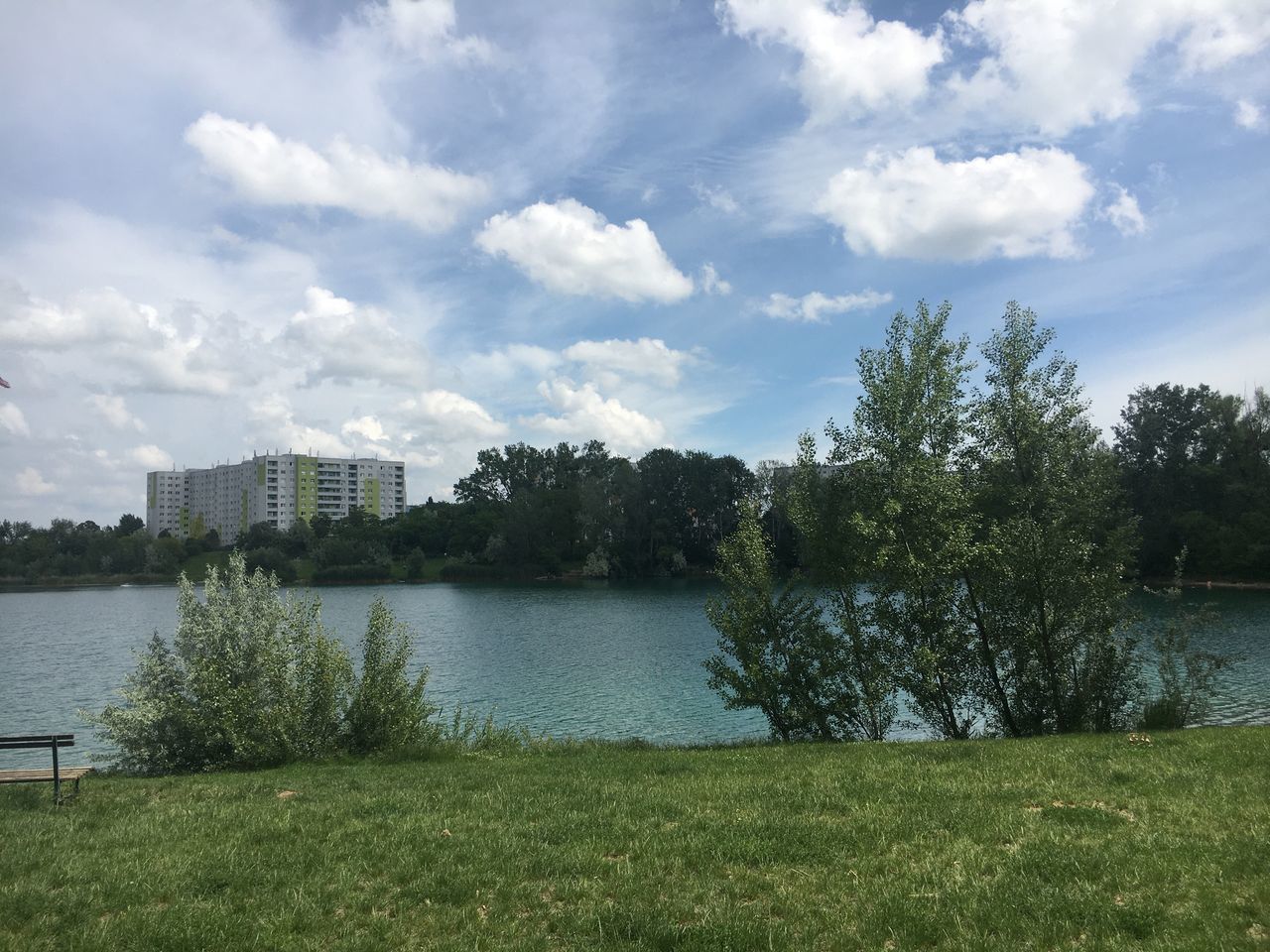 SCENIC VIEW OF LAKE AGAINST SKY IN CITY