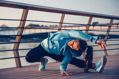 Confident woman exercising in city