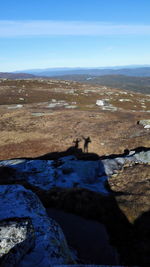 Scenic view of landscape against blue sky