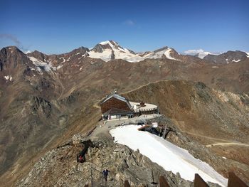 High angle view of snowcapped mountain against sky