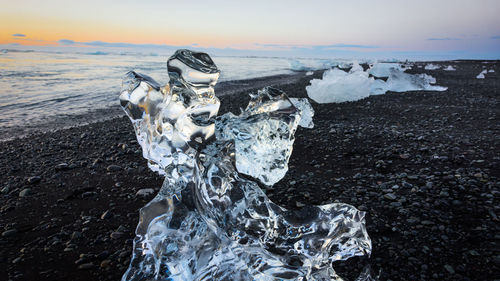 Scenic view of sea against sky during winter