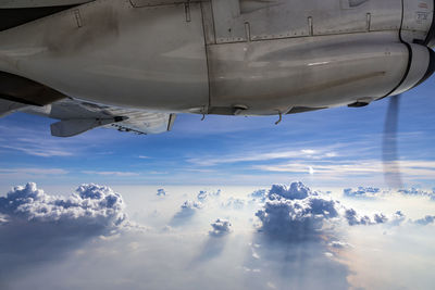 Low angle view of airplane flying in sky