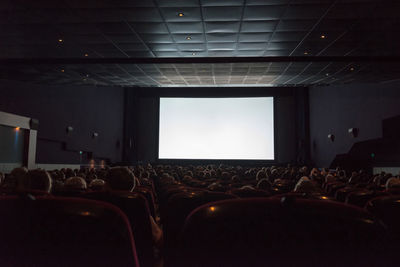 Rear view of audience in movie theater