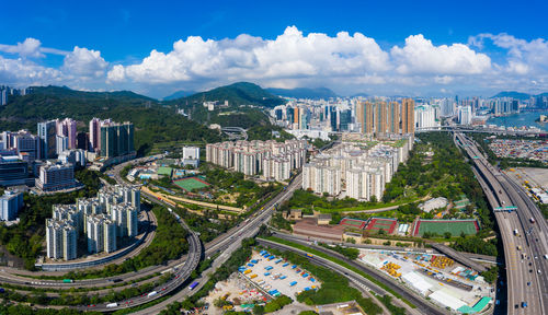 High angle view of city buildings against sky