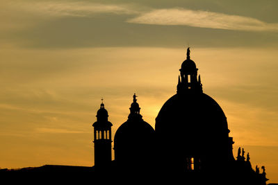 Silhouette cathedral against sky during sunset