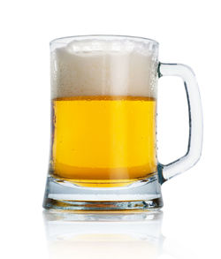 Close-up of beer glass against white background