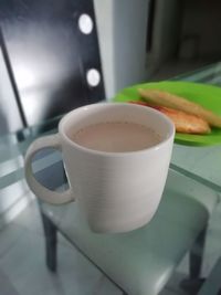 High angle view of coffee cup on table