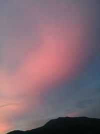 Scenic view of silhouette mountain against sky at sunset