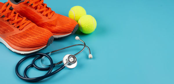 High angle view of balls on table against blue background