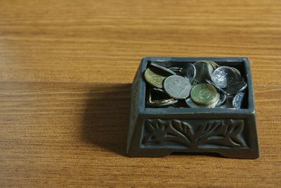 High angle view of coins on table