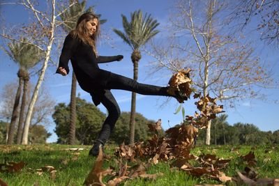 Full length of woman standing on grass