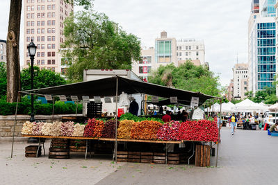 Street market against buildings in city