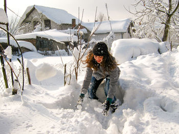 Full length self portrait and snow covered ground