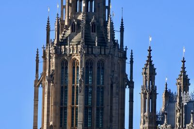 Low angle view of  the palace of westminster against sky