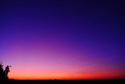 Scenic view of silhouette landscape against romantic sky at sunset