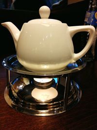 Close-up of ice cream in front of kitchen