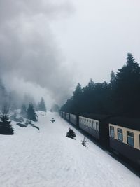 Scenic view of snow covered mountains against sky