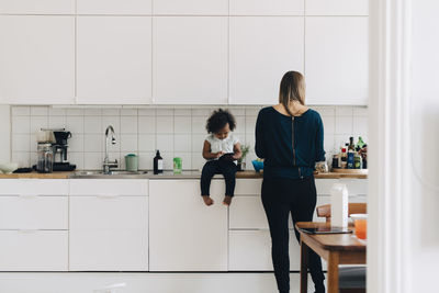 Women standing at home