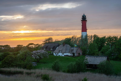 Panoramic image of pellworm lighthouse against sunrise, north frisia, germany
