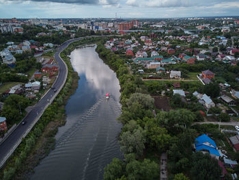 High angle view of city by river