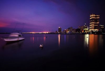 Illuminated city at waterfront